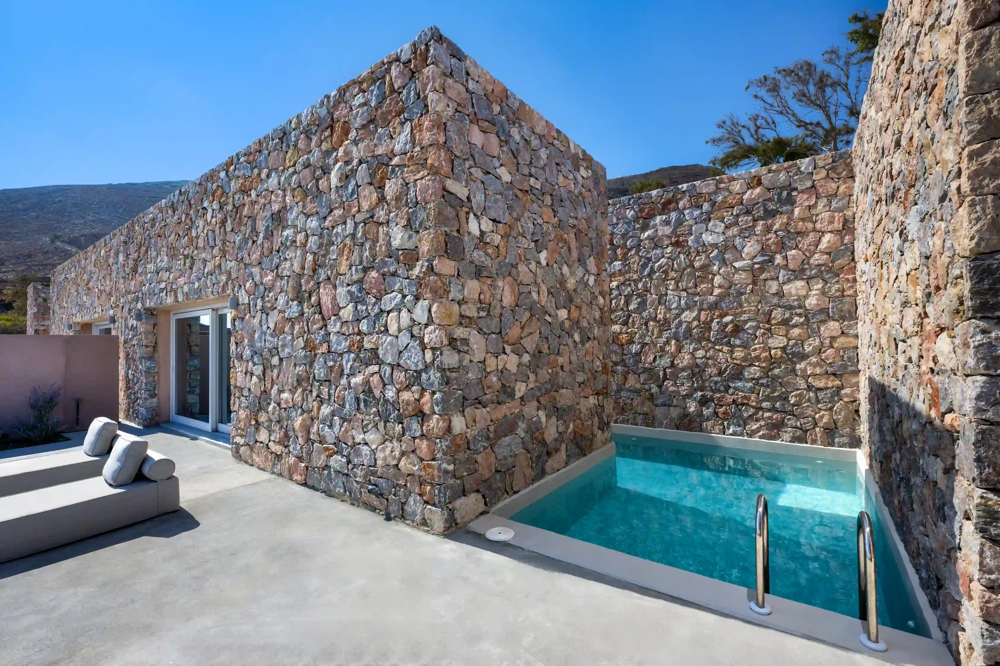 Deluxe Eros Cave Villa - Private pool with stone architecture and Aegean Sea views in Santorini