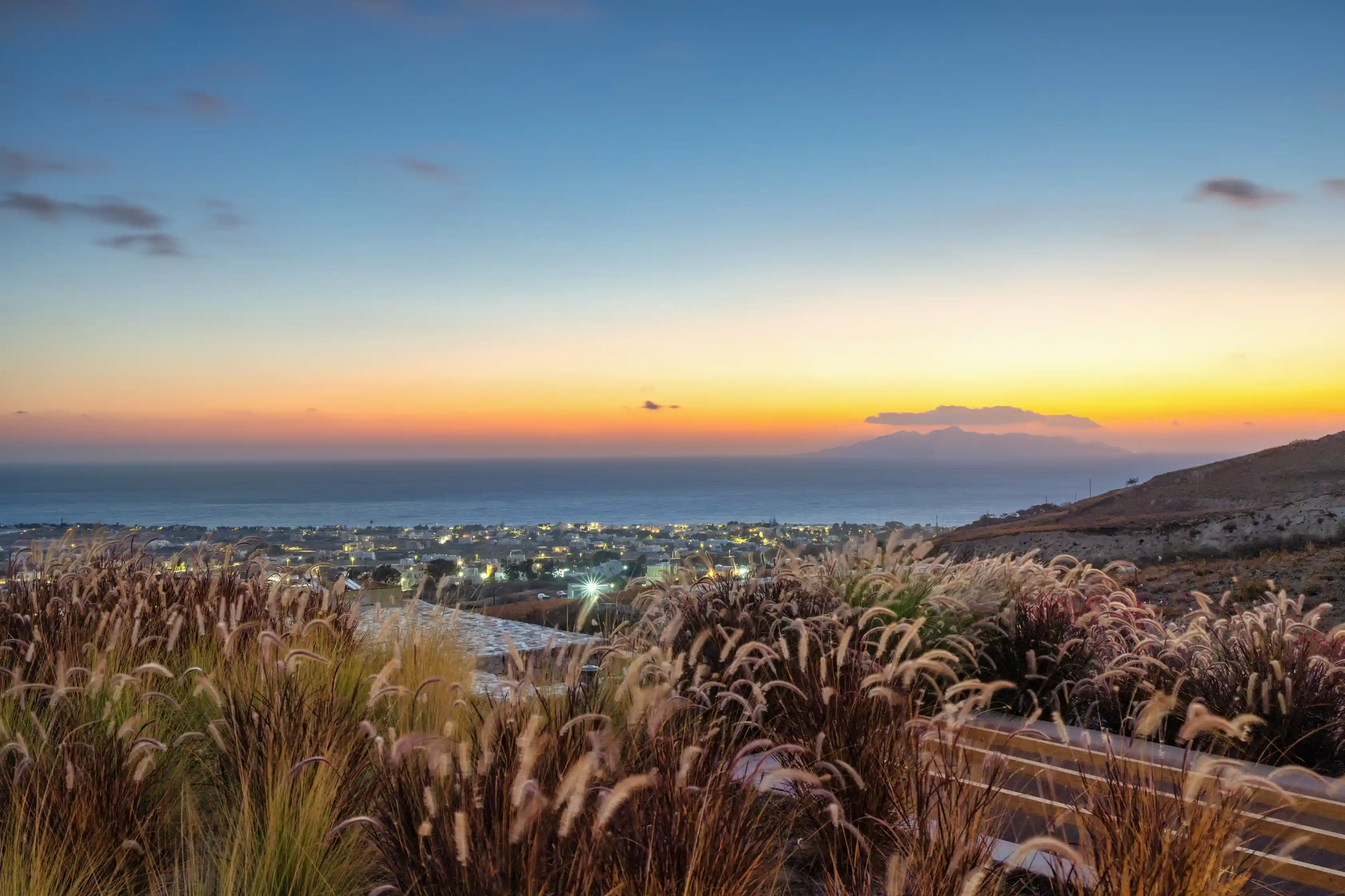 Santorini sunset views from Felicity Cave Villas - Panoramic sea and mountain vistas at golden hour