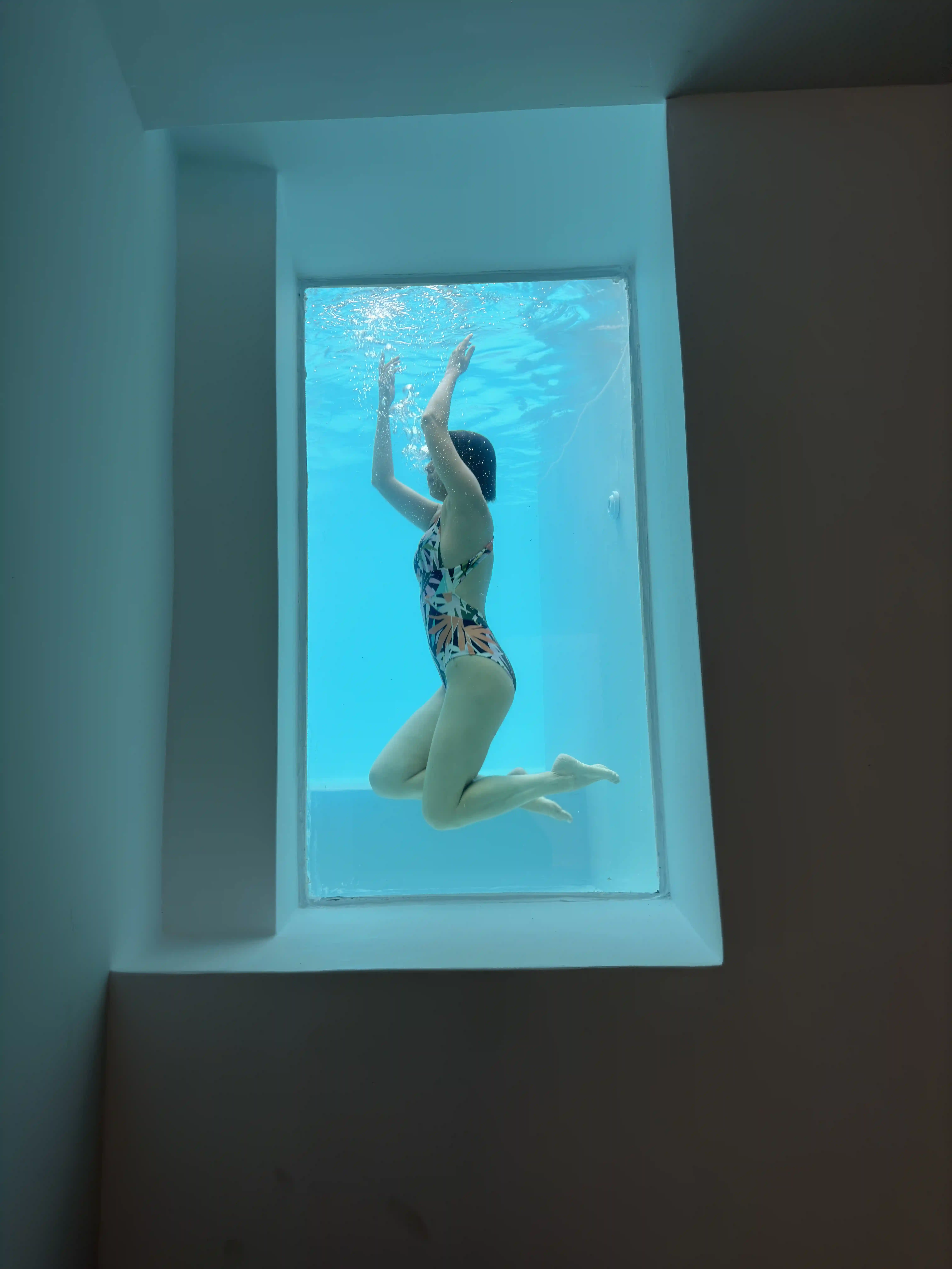 Unique submarine window pool at Deluxe Eros Cave Villa - Underwater viewing experience in Santorini