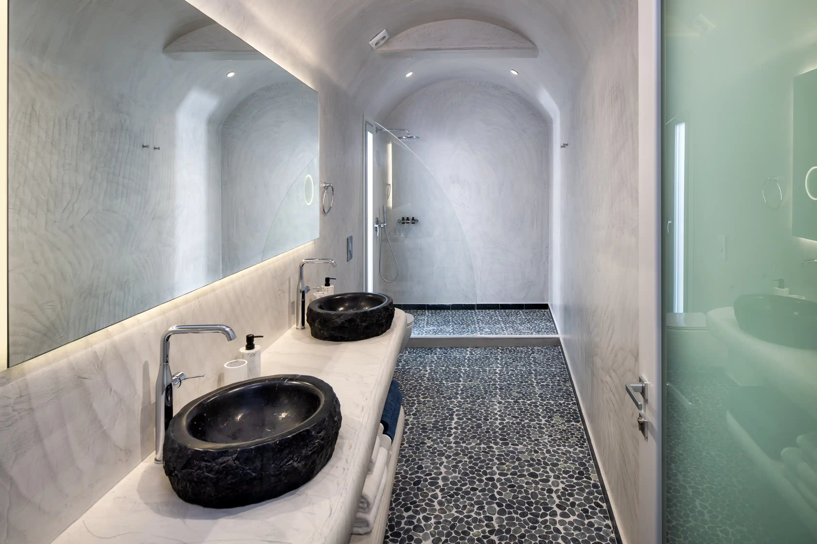 Deluxe Eros Cave Villa luxury bathroom - Stone sink with authentic Cycladic design elements
