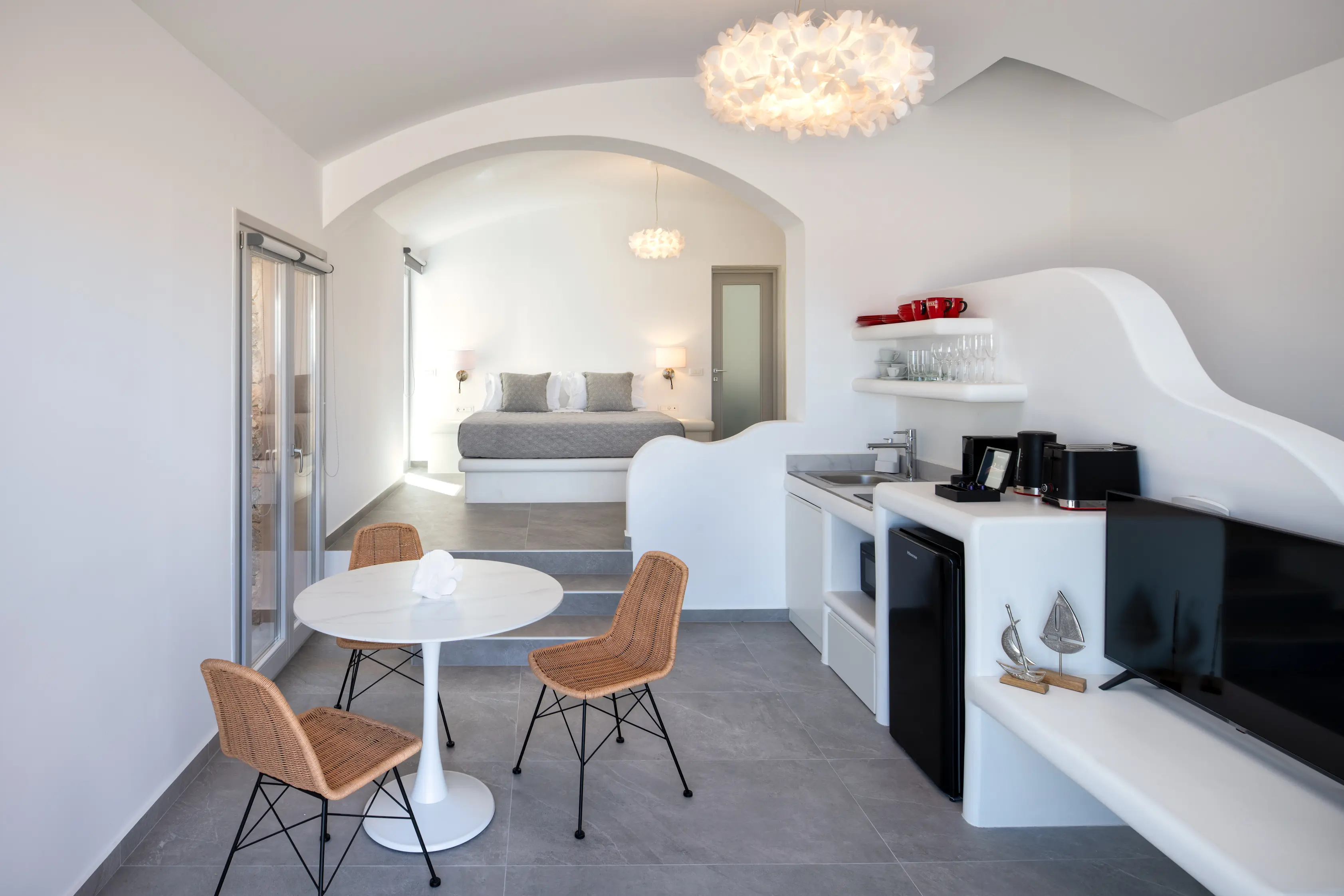 Superior Cave Villa modern kitchen and living area - Contemporary open-plan design with stone accents